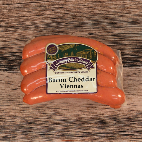 Packaged Bacon Cheddar Viennas on a wooden surface
