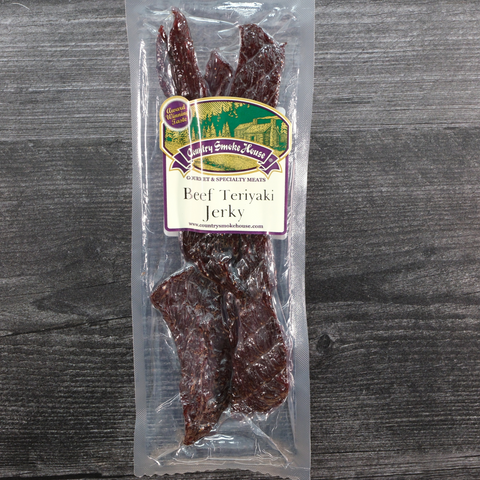 Packaged beef teriyaki jerky on a wooden surface