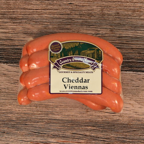Packaged Cheddar Viennas on a wooden surface