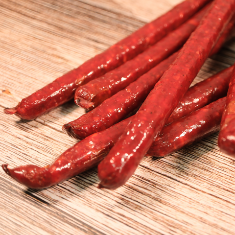 Close up of unpackaged Elk Cherry Cheddar Snack Stix