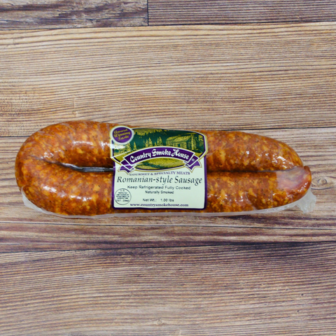 Packaged Romanian Style Sausage on a wooden surface.