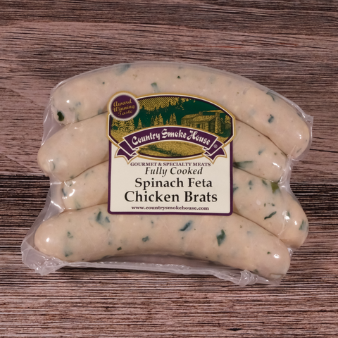 Packaged Spinach Feta Chicken Brats on a wooden surface.