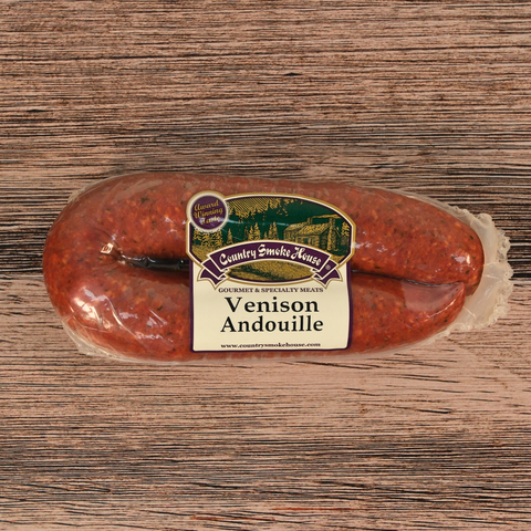 Packaged Venison Andouille on a wooden surface