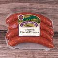 Packaged Venison Cheesie Weenies on a wooden background.