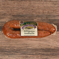 Packaged Alligator Andouille on a wooden surface