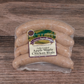 Packaged Apple Maple Chicken Brats on a wooden surface