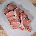 Five pounds of bone in center cut pork chops on butcher paper