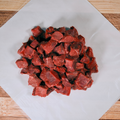 Five pounds of beef stew meat on butcher paper