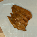 Four Black Garlic Chicken Breasts on butcher paper