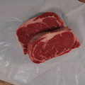 Boneless Ribeye Steaks on butcher paper