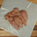 Three pounds of Chicken Tenders on butcher paper