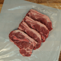 Four Pork Steaks on butcher paper