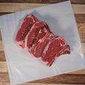 Four T-Bone Steaks on butcher paper