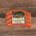 Packaged Bacon Cheddar Viennas on a wooden surface
