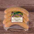 Packaged Bacon, Mac & Cheese Brats on a wooden surface