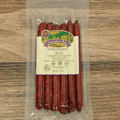 Packaged Beef Cheddar Cheese Snack Stix on a wooden surface