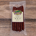 Packaged Beef Ghost Pepper Snack Stix on a wooden surface