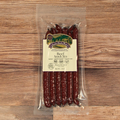 Packaged Beef Mild Snack Stix with a label on a wooden surface