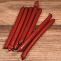 Beef Salami Snack Stix on a wooden surface