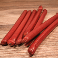 Beef Salami Snack Stix on a wooden surface