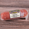 Packaged Buffalo Cheddar Cheese Salami chub on a wooden surface.