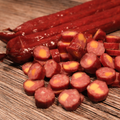Sliced Buffalo Cheddar Cheese Snack Stix on a wooden surface