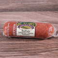 A packaged Buffalo Jalapeno Cheese Salami chub on a wooden surface.