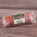 A packaged Buffalo Salami chub on a wooden surface.