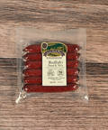 Packaged Buffalo Snack Stix on a wooden surface