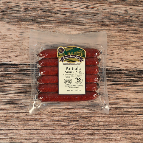 Packaged Buffalo Snack Stix on a wooden surface