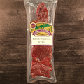 Packaged Buffalo Peppered Jerky with a label on a wooden surface