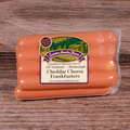 Packaged All Natural Homestyle Cheddar Cheese Frankfurters on a wooden background.