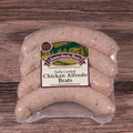 Packaged Chicken Alfredo Brats on a wooden surface