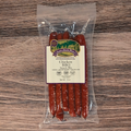 Packaged Chicken BBQ Snack Stix on a wooden surface