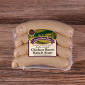 Packaged Chicken Bacon Ranch Brats on a wooden surface.