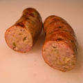Close up of a sliced Dill Pickle Brat