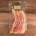 Packaged Premium Sugar Cured Double Smoked Bacon on a wooden surface