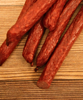 duck snack sticks on a wood surface