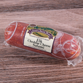 A packaged Elk Cheddar Cheese Salami on a wooden surface.