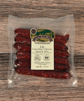 Packaged elk cheddar cheese snack sticks with a label on a wooden surface