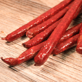 Close up of unpackaged Elk Cherry Cheddar Snack Stix 
