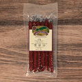 Packaged Elk Jalapeno Pepper Snack Stix on a wooden surface