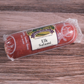 Packaged Elk Salami Chub on a wooden surface