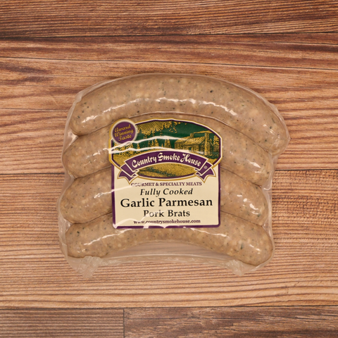 Packaged Garlic Parmesan Pork Brats on a wooden surface