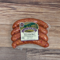 Packaged Hawaiian Brats on a wooden surface