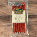 Packaged Hawaiian Snack Stix with a label on a wooden surface