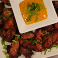 Plated dish of grilled kielbasa with a side of Hot Jalapeno Mustard.
