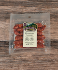 Packaged Hunters Sausage on a wooden surface