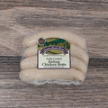 Packaged Italian Chicken Brats on a wooden surface