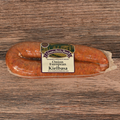 Packaged Onion European Kielbasa on a wooden surface